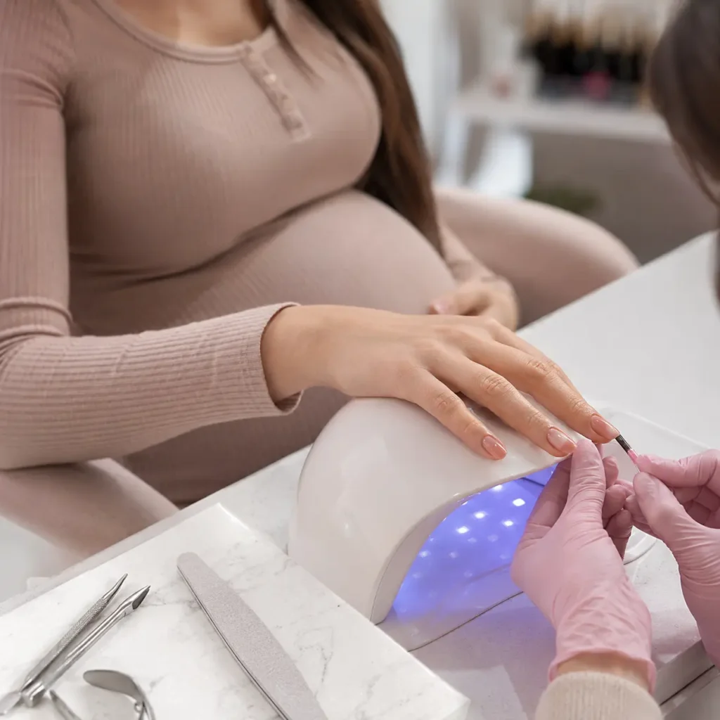 Woman getting her nails done while pregnant with regular nail polish