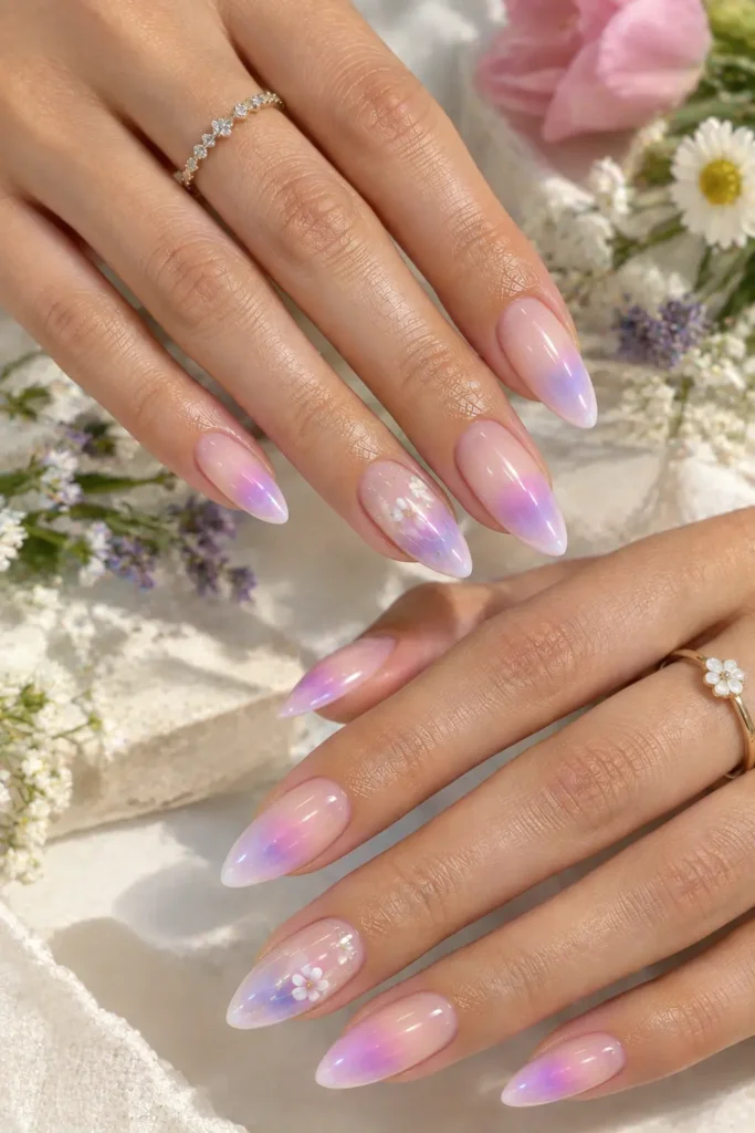 Pastel aura manicure with tiny white floral nail art