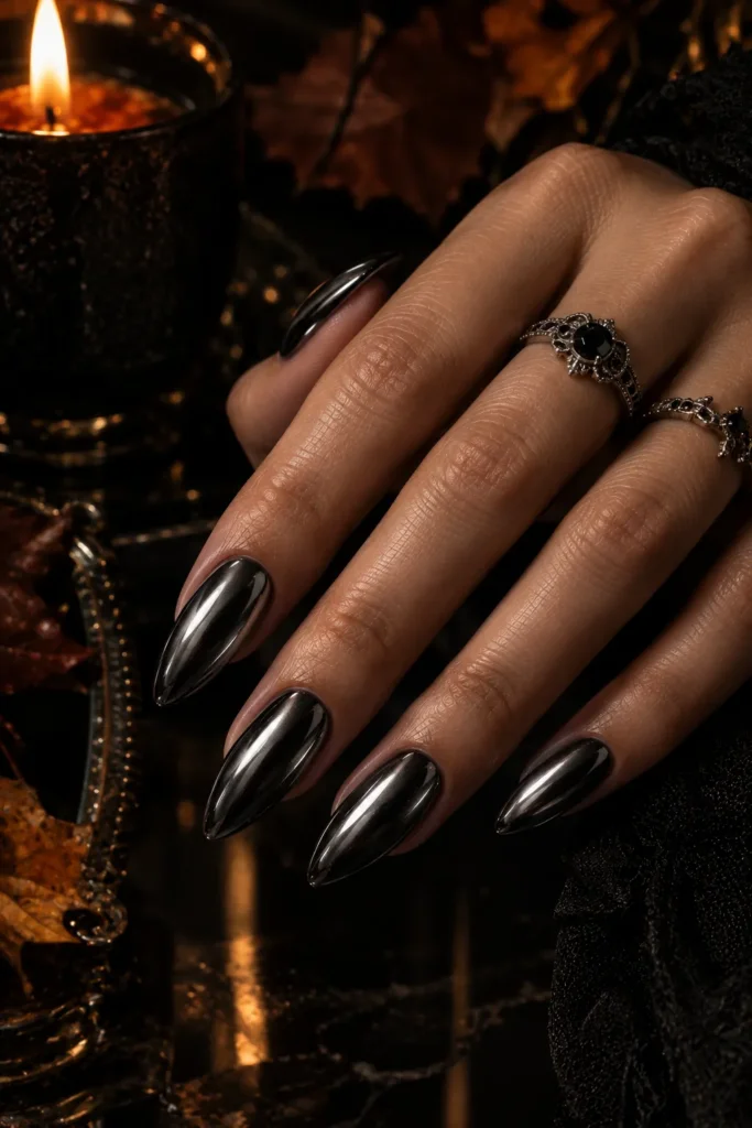 Medium almond nails with reflective black chrome finish