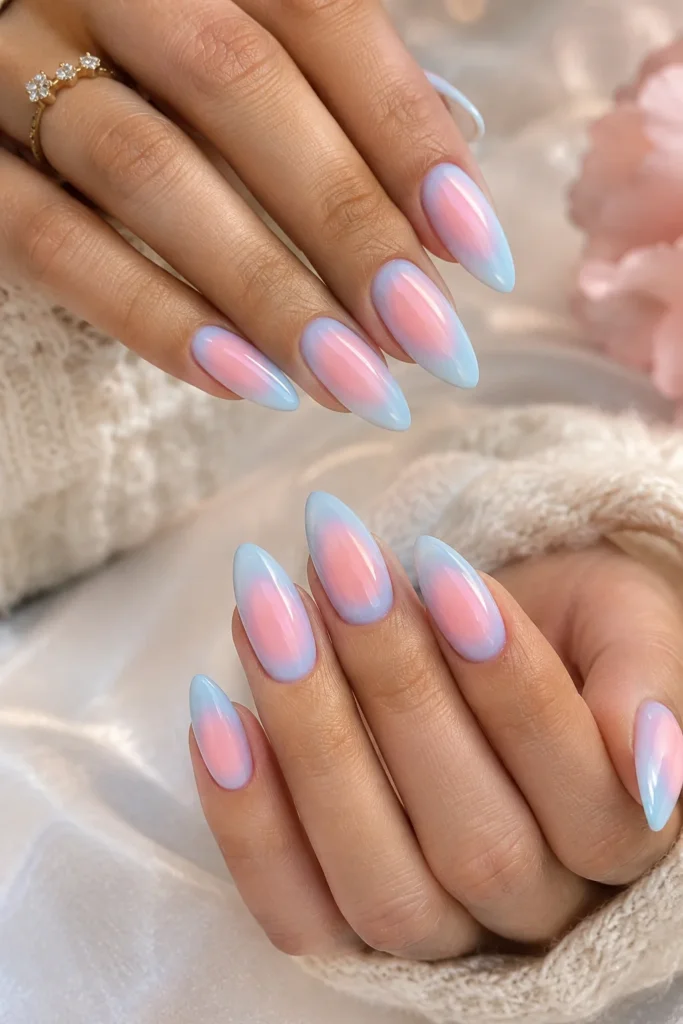 Pastel blue and pink manicure with a soft blended aura effect