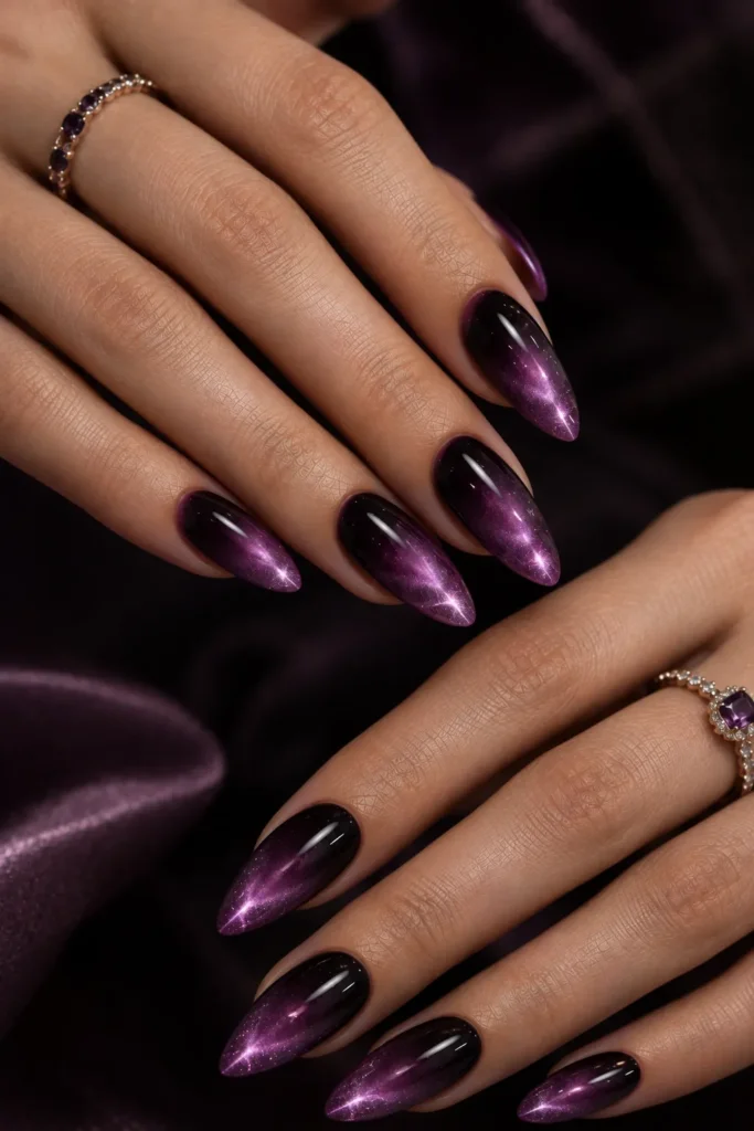 Cat eye ombre nails fading from deep plum to luminous violet