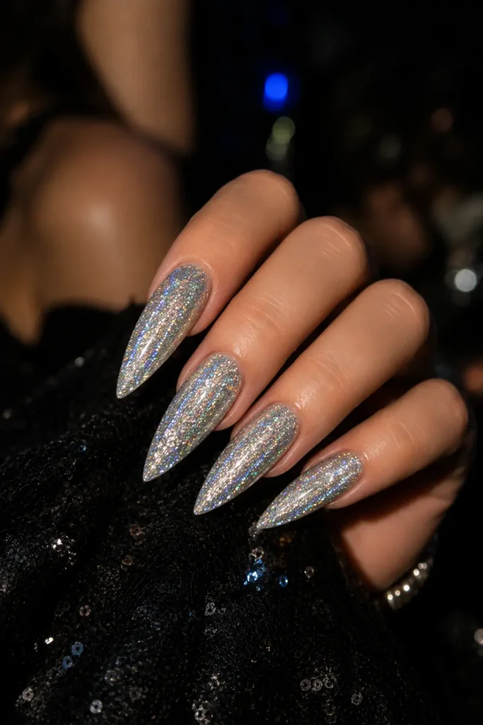 Holographic glitter stiletto nail idea in fine silver