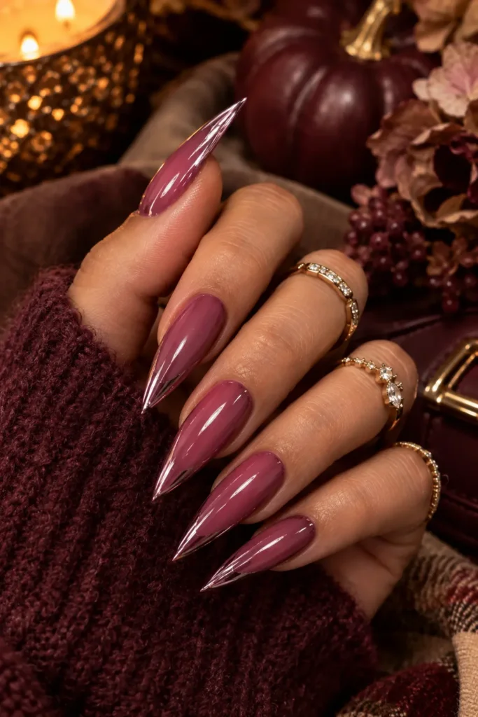 Pink nails with a bold berry pink stiletto shape