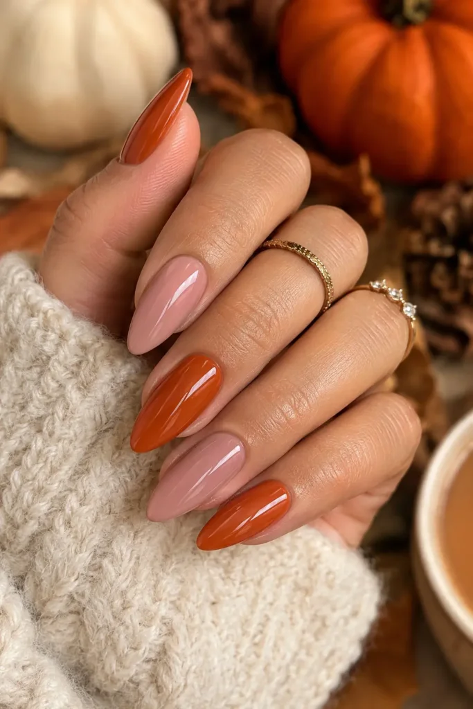 Pink nails paired with warm burnt orange accents
