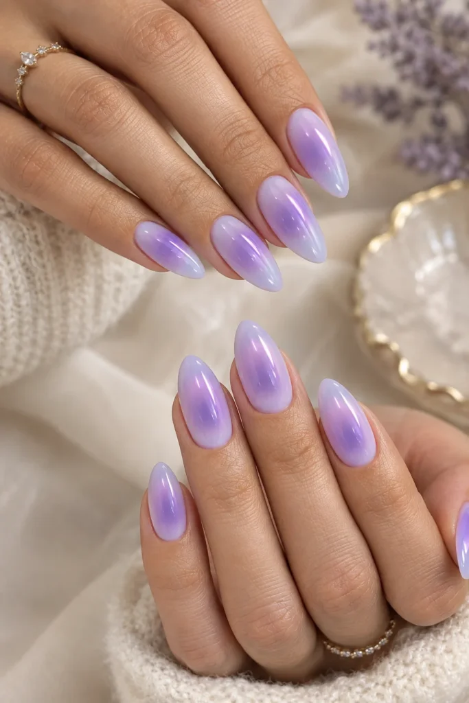 Lavender and violet gradient manicure on almond-shaped nails