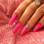 Hot pink country glam Dolly Parton nails with rhinestone details