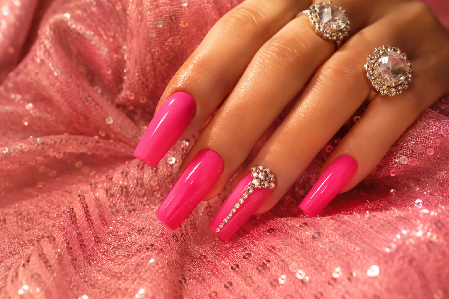 Hot pink country glam Dolly Parton nails with rhinestone details