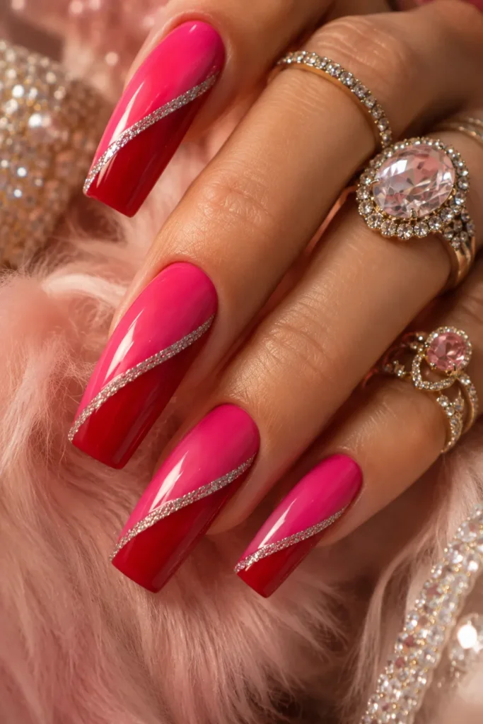 Diagonal pink and red color-block nails with a silver glitter line