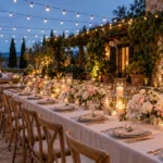 Wedding reception themes: garden courtyard with blush flowers and ivory table settings.