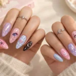 Anime nails ideas featuring colorful kawaii nail art in pastel pink, lavender, blue, and black