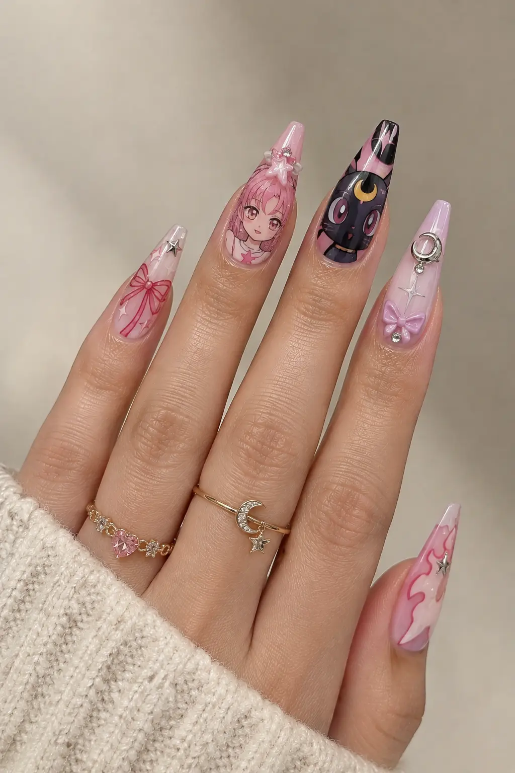 Long anime acrylic nails with detailed character-inspired art and decorative accents