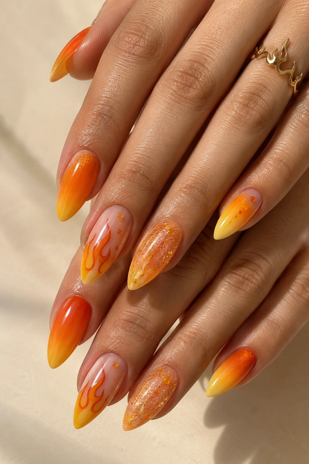 Charmander-inspired nail art with orange polish and flame details
