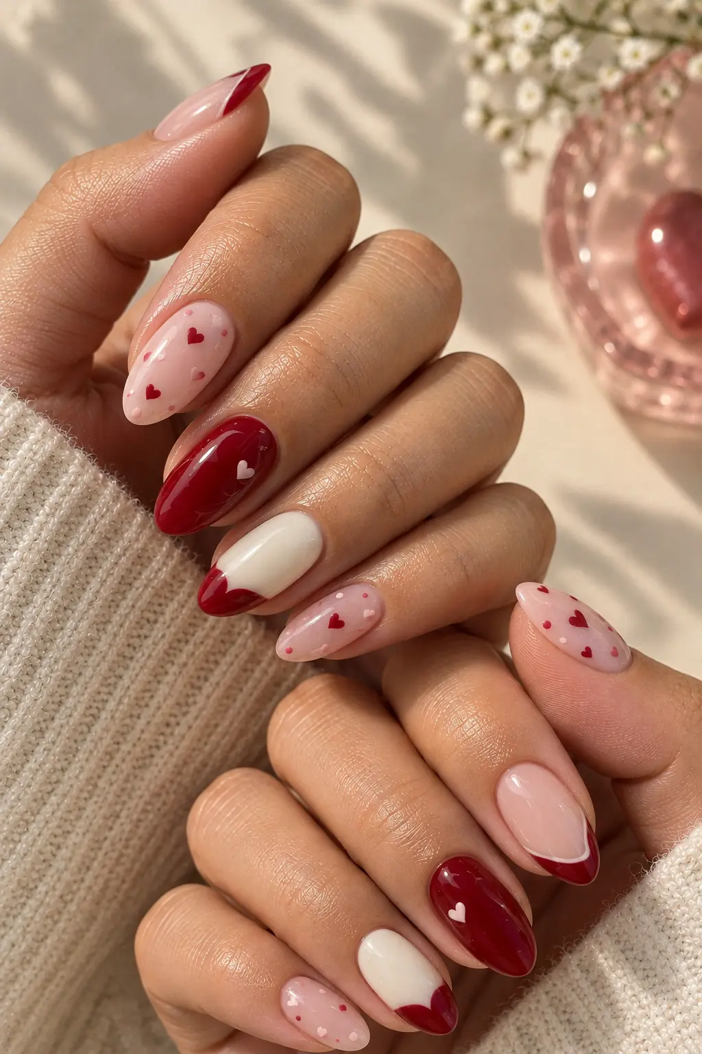 Pink and red Pokémon Valentine's Day nails with heart accents