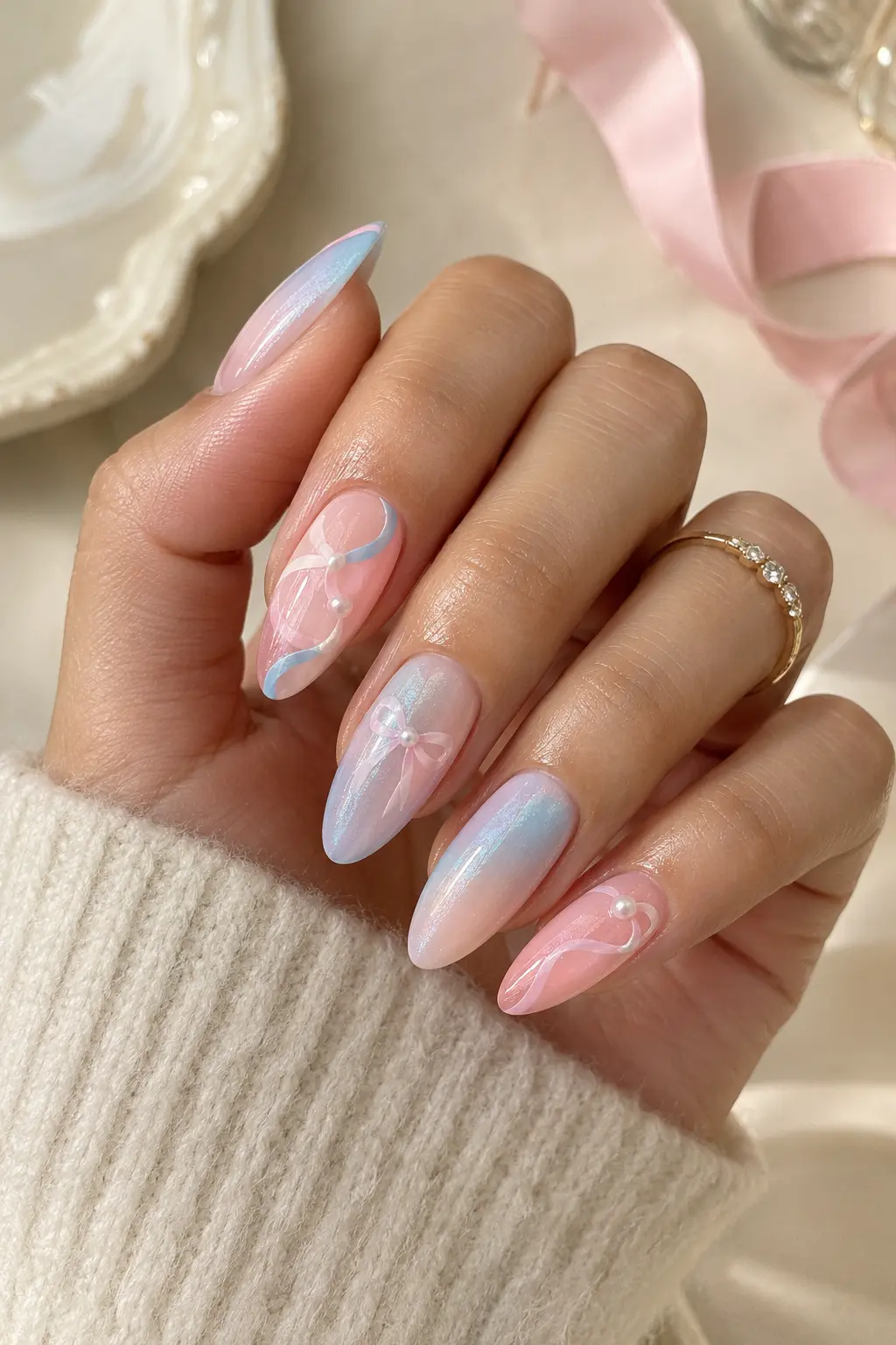 Pastel Sylveon nails with delicate pink and blue ribbon details