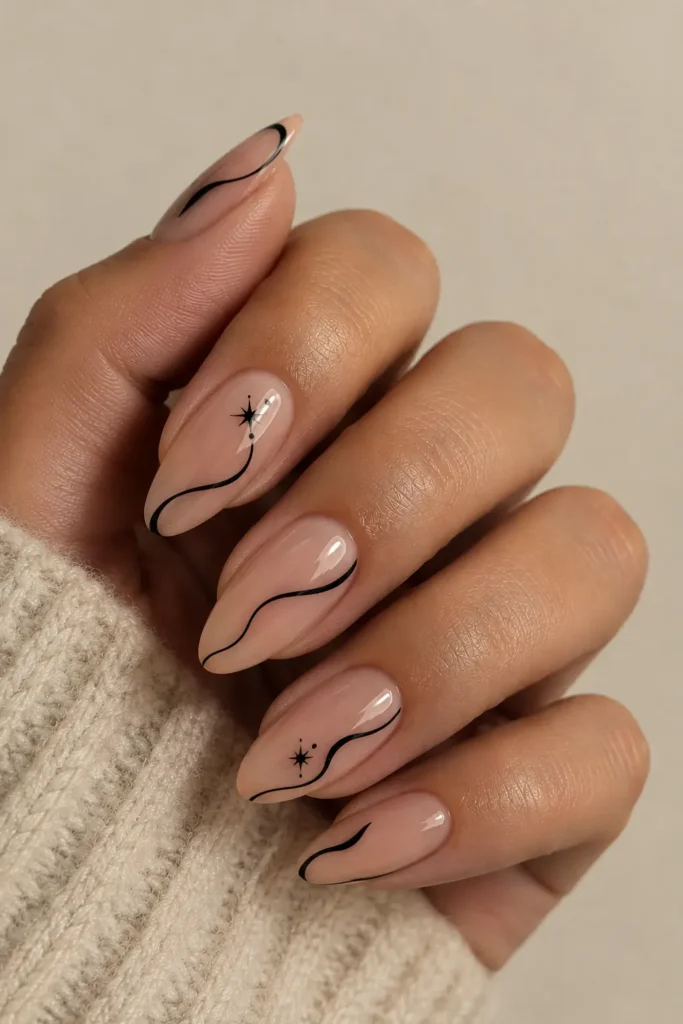 Nude nails with thin black swirl line art