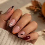 Easy Halloween nail designs with ghosts, black French tips, pumpkins, and bats