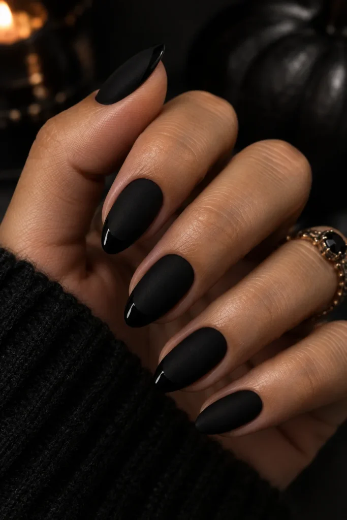 Matte black nails with subtle glossy black tips