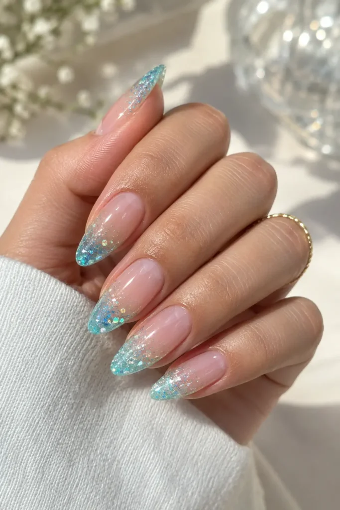 Aqua and pearl ombré manicure with fine iridescent glitter