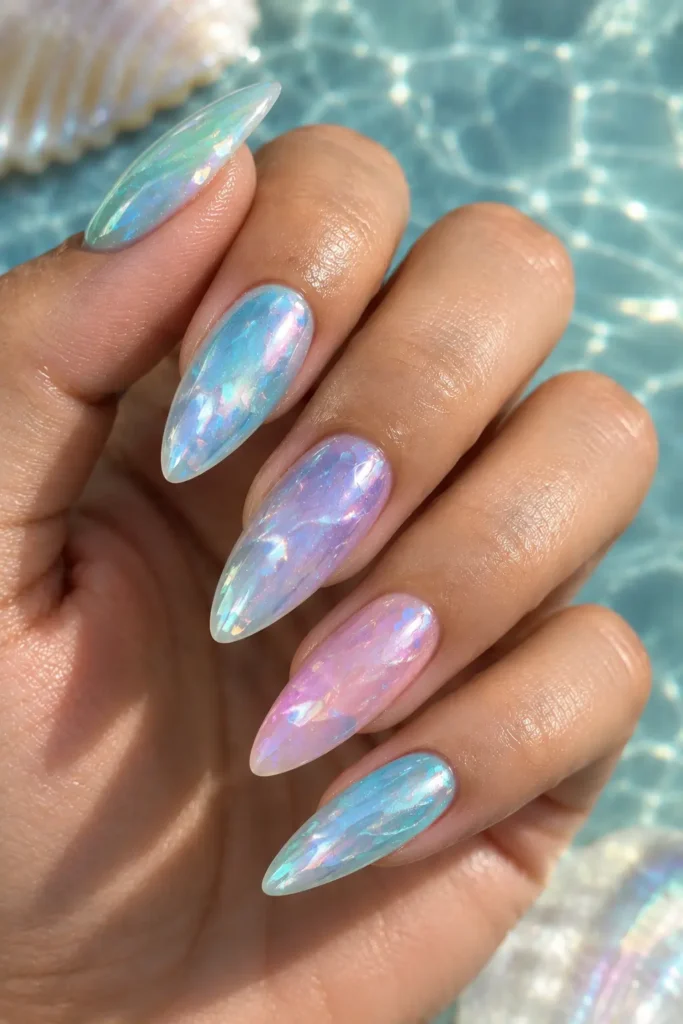 Pastel manicure in blue, lavender, mint, pink, and pearl shades